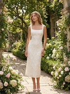 Female model wearing the floral lace square-neck A-line midi dress in a garden setting