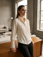 Model in tailored long-sleeve blouse