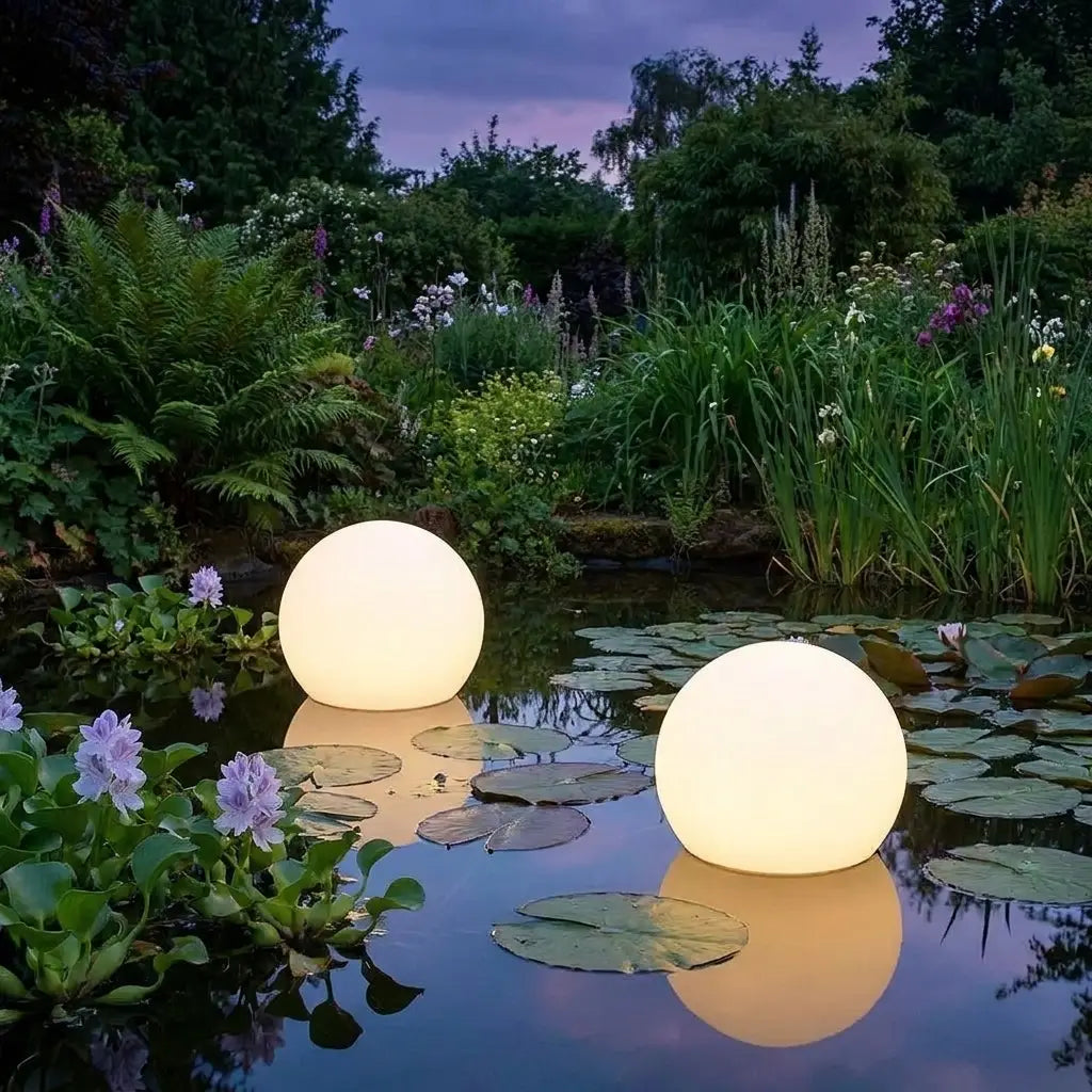Solar LED garden ball lights glowing at dusk