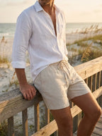 Model in oatmeal linen shorts
