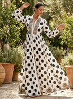 Model in white long-sleeve maxi dress