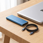 Compact 4TB portable external hard drive on a modern desk