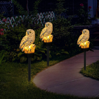 Solar owl garden light glowing