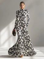 Model wearing the abstract floral mermaid maxi dress in Red