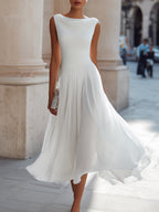 Female model wearing the white draped-neck blouse