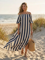 Model in striped split maxi dress