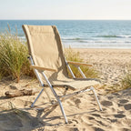 Low folding beach chair on sand