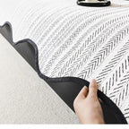 Herringbone scallop-edge sofa cover detail