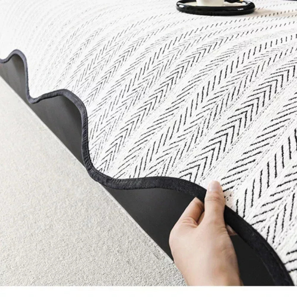 Herringbone scallop-edge sofa cover detail
