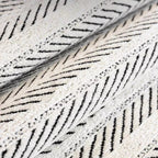Herringbone scallop-edge sofa cover detail