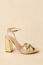 Women's Charmed I'm Sure Gold Woven Bow Block Heel Sandals | Heel measures 3.75" 2