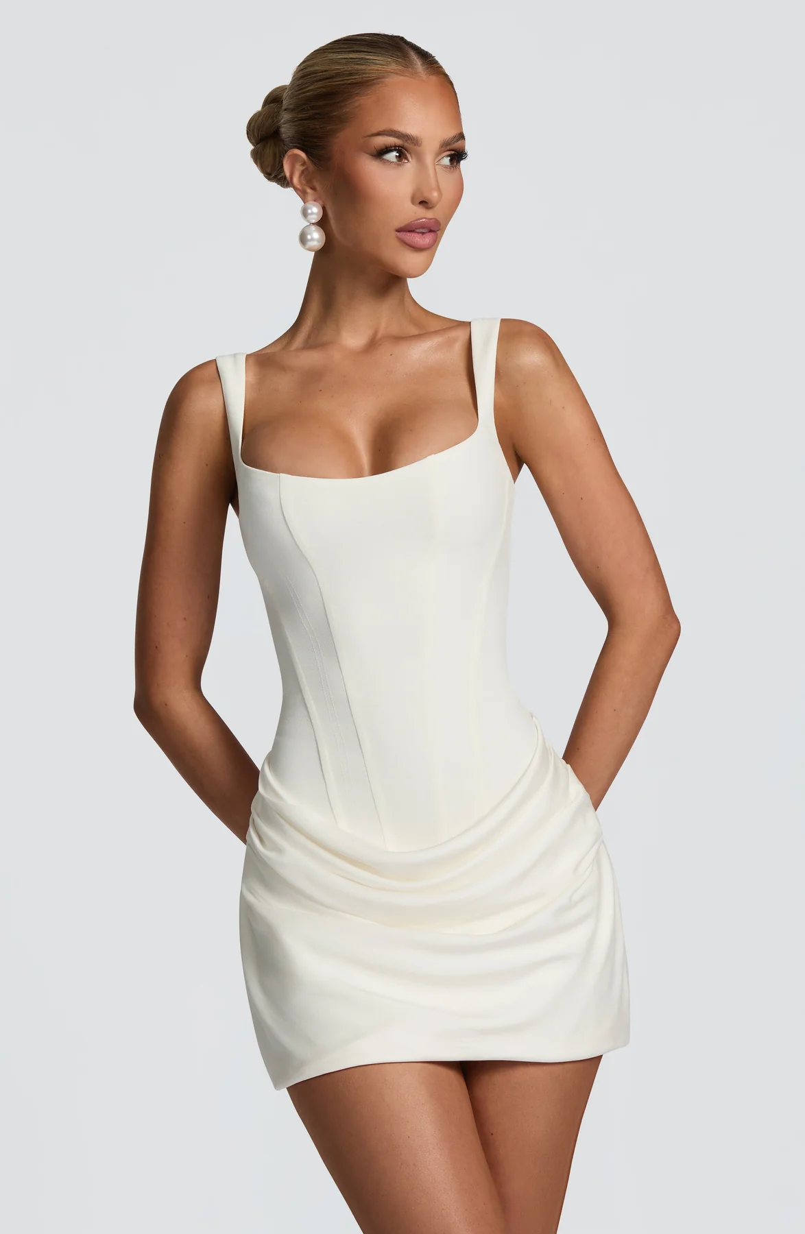 Elegant Mini Dress with Draped Skirt & Lace-Up Back
