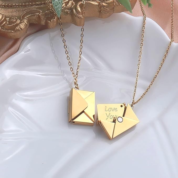 Gold Love Letter necklace on plate