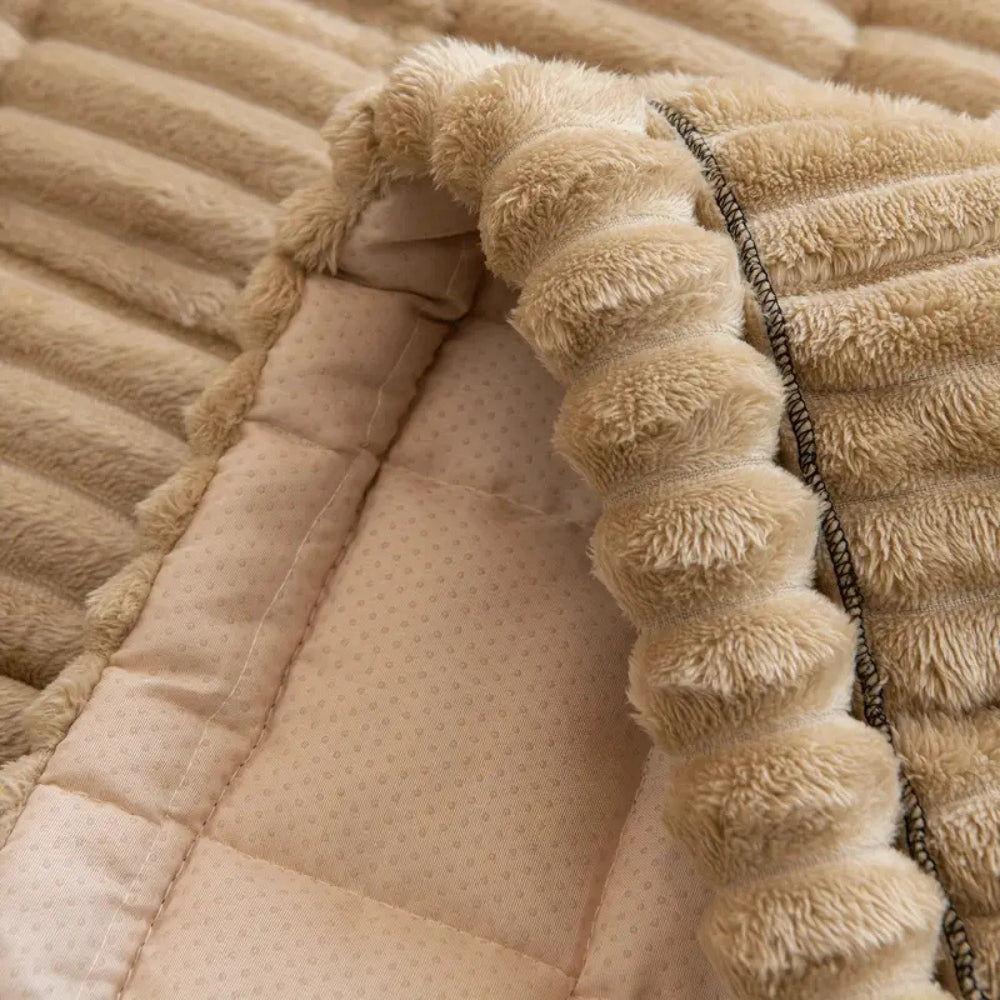 Plush pleated-edge sofa cover detail