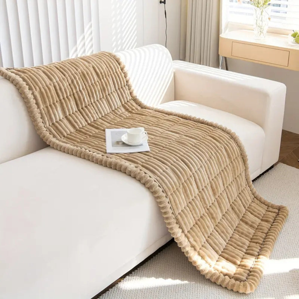 Plush pleated-edge sofa cover detail