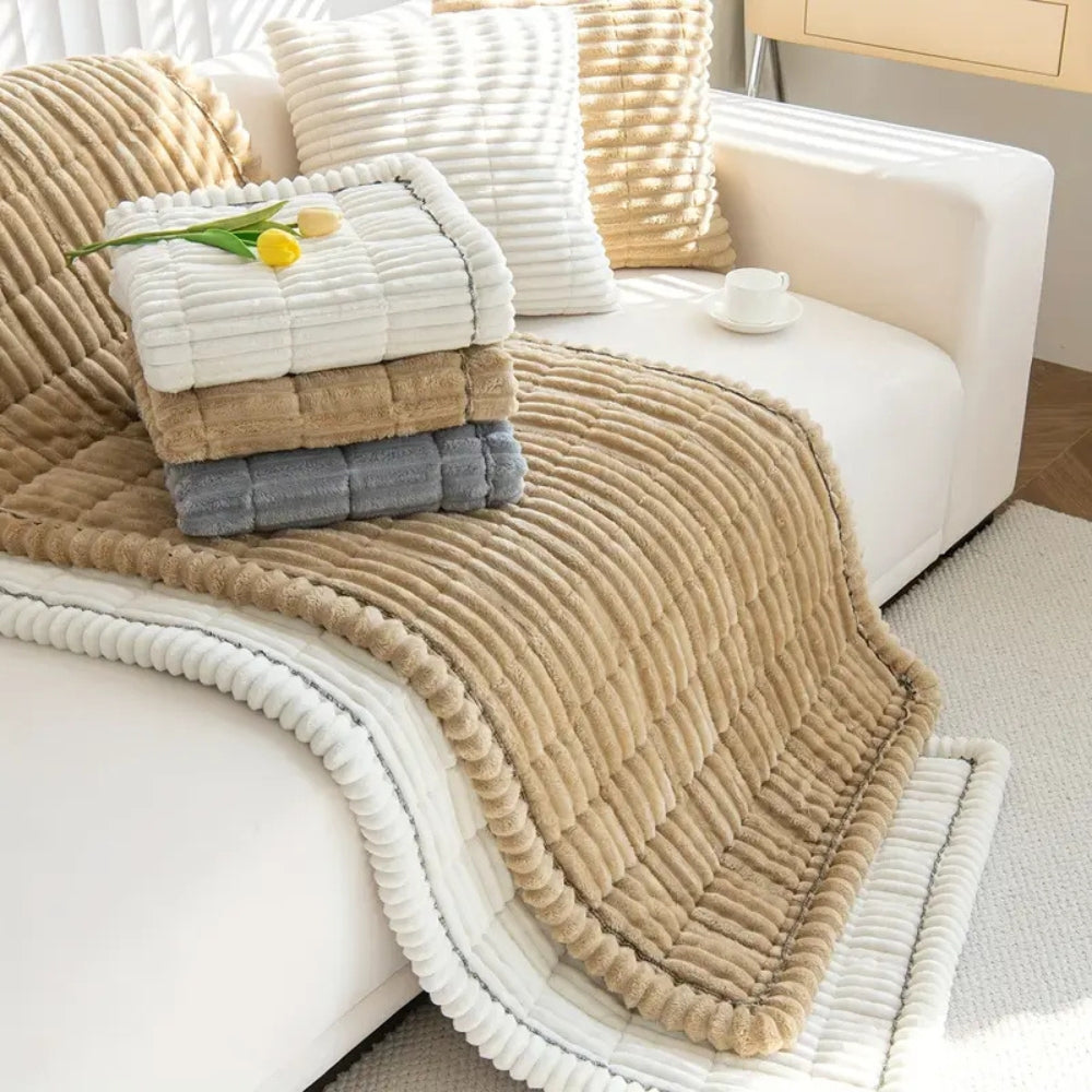 Plush pleated-edge sofa cover detail