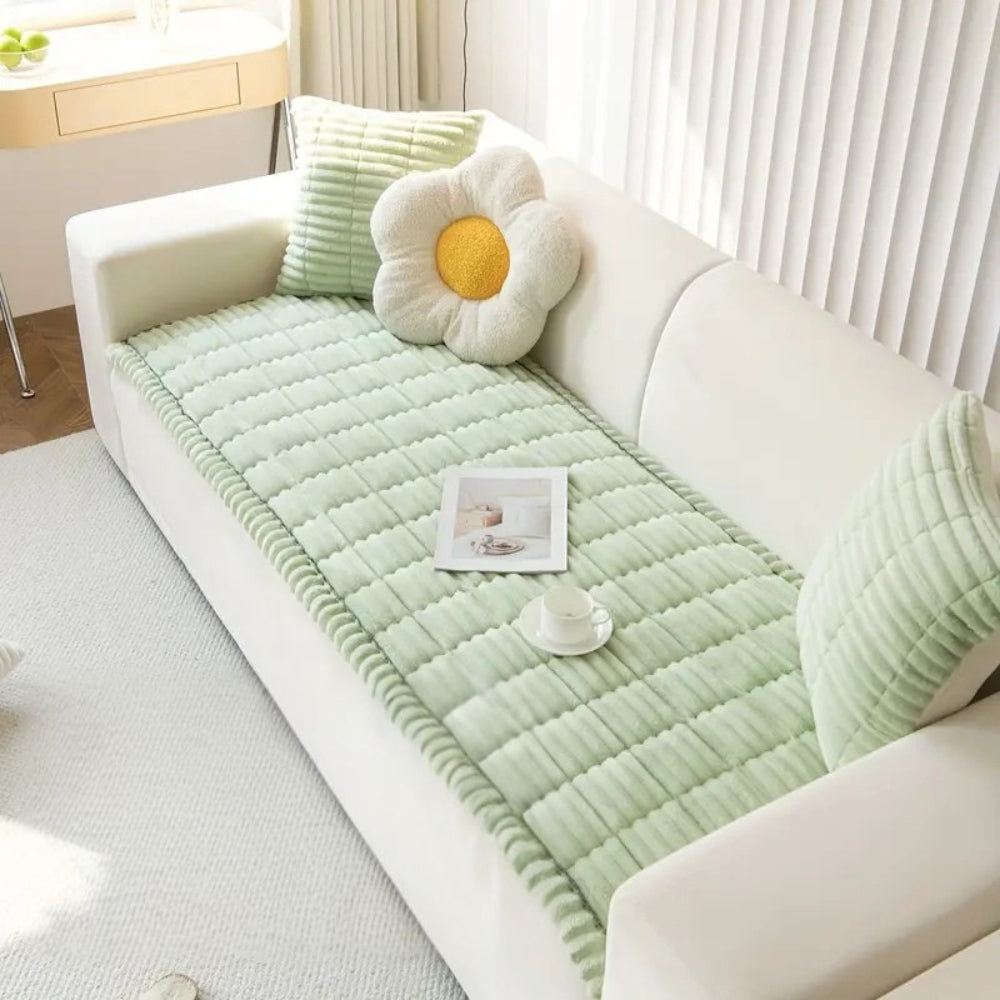 Plush pleated-edge sofa cover detail