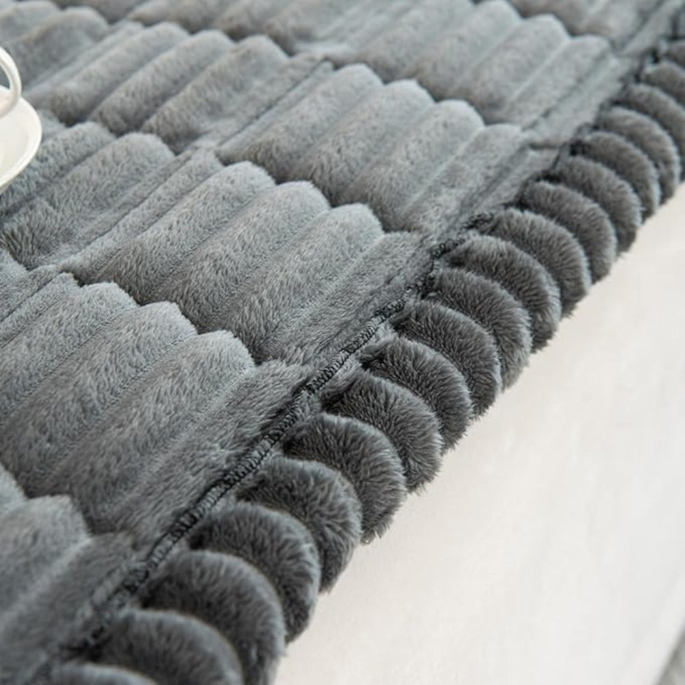 Plush pleated-edge sofa cover detail