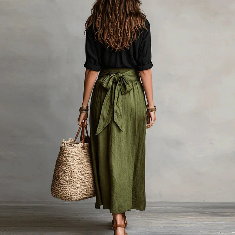 Women's two-piece button lapel top and tie-waist skirt set detail