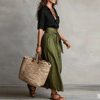 Women's two-piece button lapel top and tie-waist skirt set detail