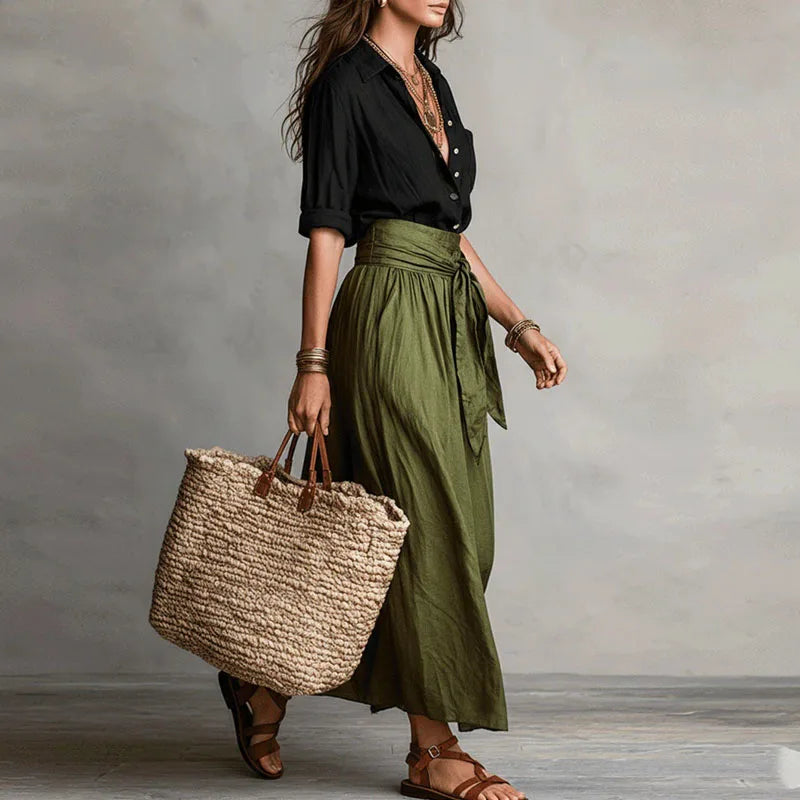 Women's two-piece button lapel top and tie-waist skirt set detail