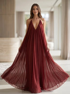 Model wearing the elegant V-neck chiffon flowy maxi dress in Deep Red