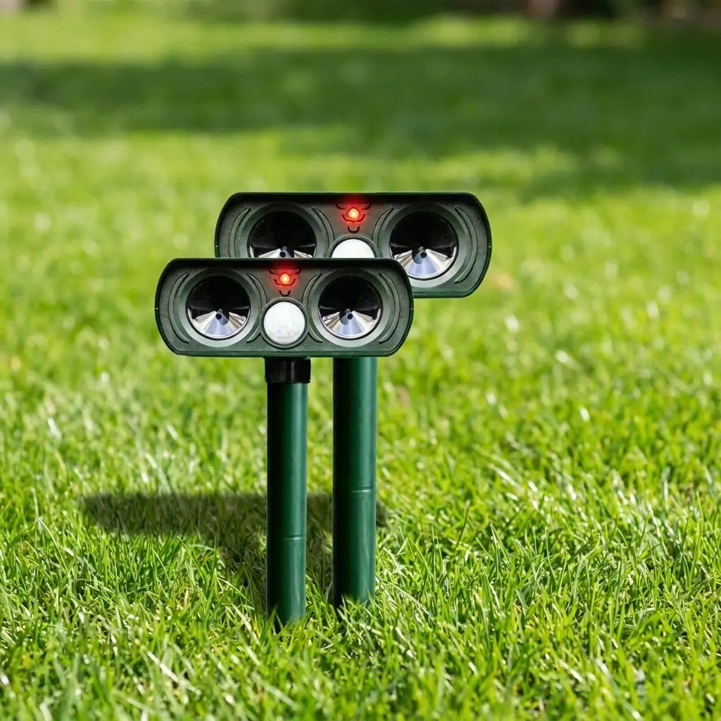 Solar pest repeller staked in a garden