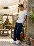 Male model wearing soft fleece jogger pants in a relaxed casual setting