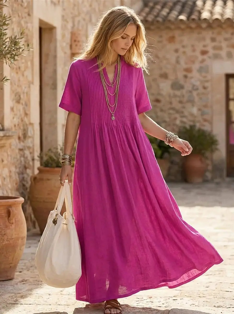 Model in pleated maxi dress