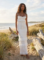 Model in white crochet maxi dress