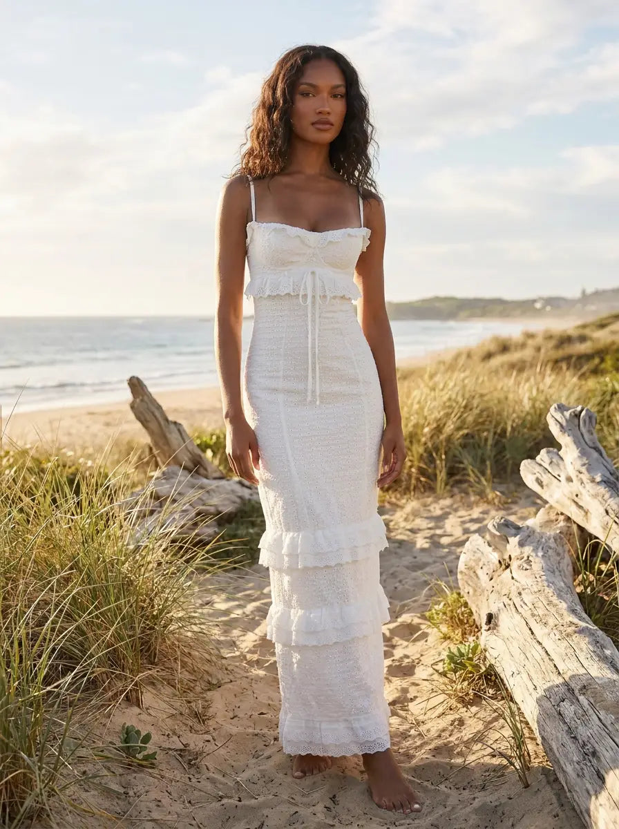 Model in white crochet maxi dress
