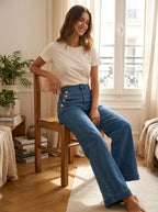 Model in indigo wide-leg jeans