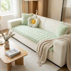 Plush pleated sofa cover on couch
