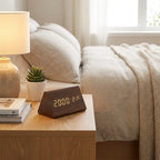 Wooden LED alarm clock on bedside table