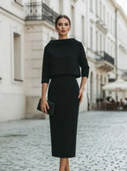 Model wearing the boat-neck top and midi skirt two-piece set