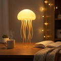 LED jellyfish lamp glowing on a desk in a dim room