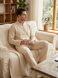 Male model wearing the men's cotton loungewear two-piece set in a cozy home setting