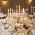 Floating LED taper candles in glass bowls of water as an elegant wedding table centerpiece