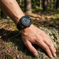 Tactical digital sports watch worn on a wrist in an outdoor setting