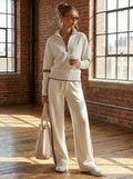 Female model wearing retro-sporty half-zip sweater and wide-leg pants set