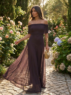 Off-shoulder chiffon maxi dress in a garden setting