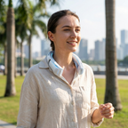 Person wearing the bladeless personal neck fan outdoors, hands-free