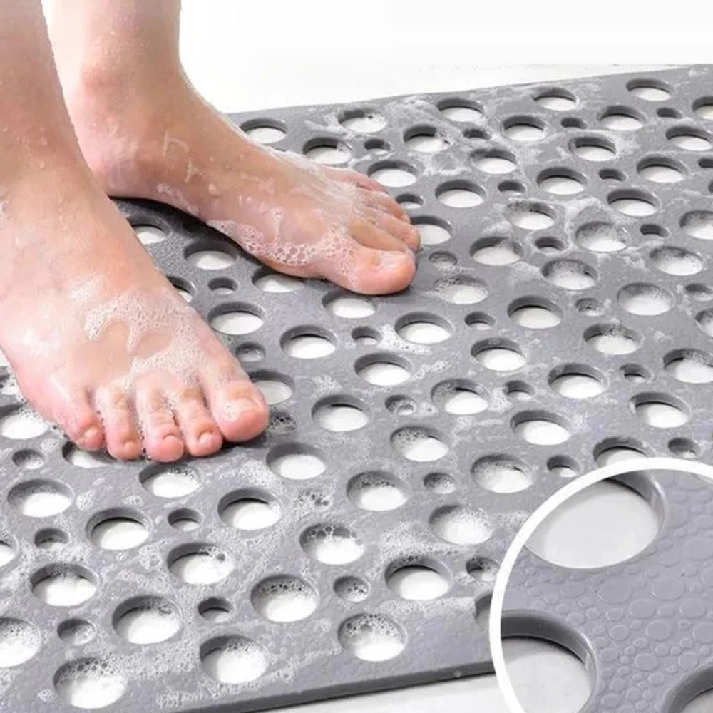 Shower mat with drainage holes for quick drying