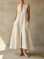 Off-white stand-collar sleeveless linen maxi dress with front slit and pockets