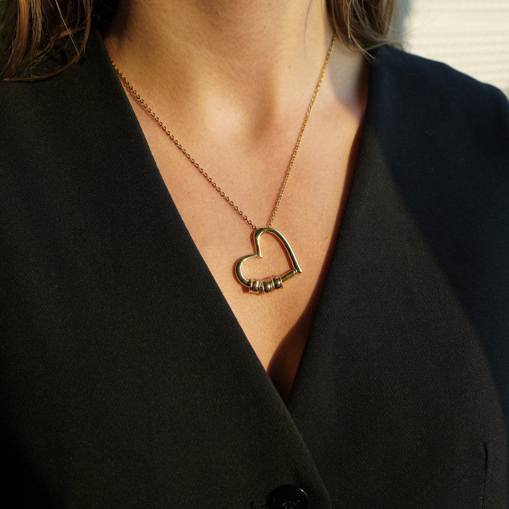 Mom wearing personalized heart necklace