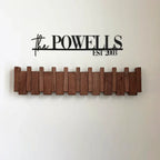 Wooden piano-shaped coat rack with hooks