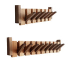 Wooden piano-shaped coat rack detail view