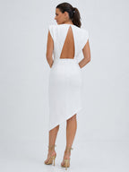 White sleeveless asymmetric dress with open back and padded shoulders, long skirt.